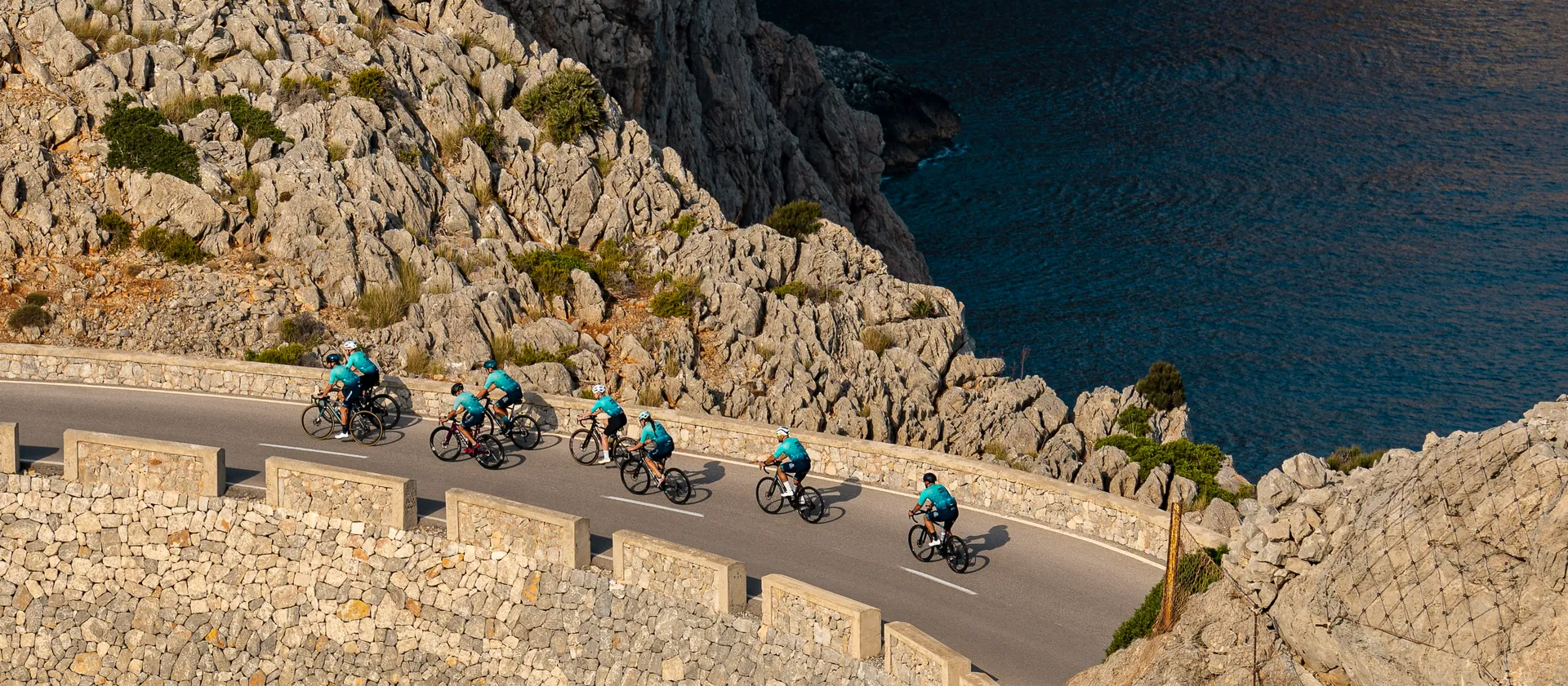 Cyclists riding a dramatic Mallorca coastal route